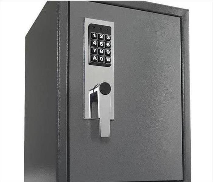  A metal safe with a nine digit key pad